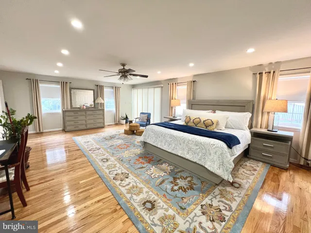 a view of a room with wooden floor and window