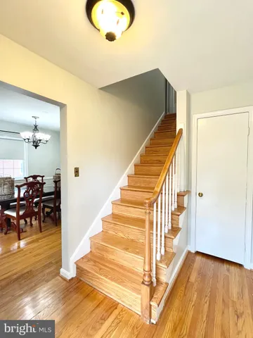 a view of a kitchen with wooden floor