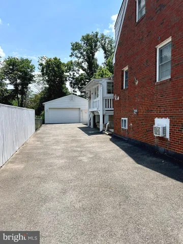 a view of a house with a yard and garage