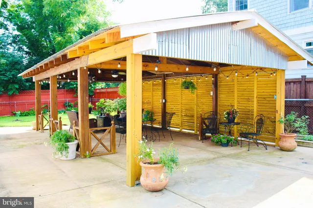 a living room with furniture a wooden floor and a piano