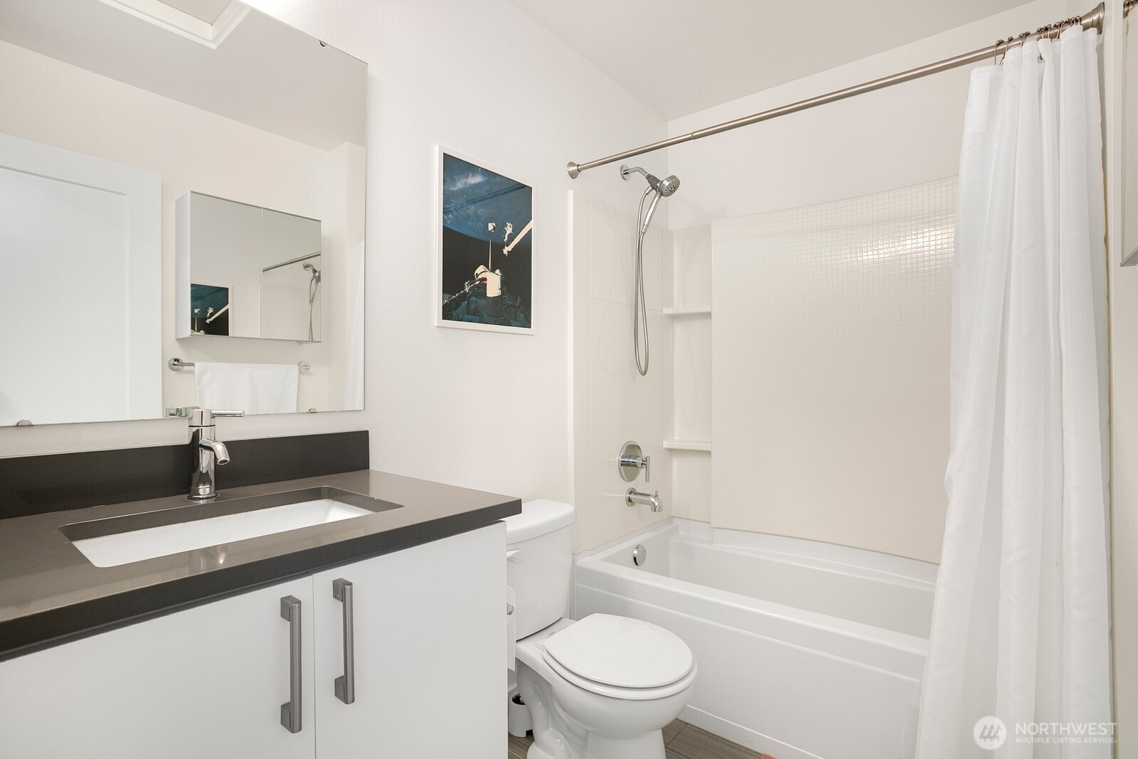 2736 South Andover Street Seattle, WA 98108 - Photo 15 of 24 a bathroom with a sink a toilet a mirror a vanity and shower