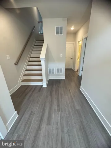 a view of entryway with wooden floor