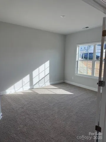 a view of empty room with windows