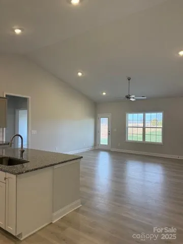 a kitchen with counter top and window