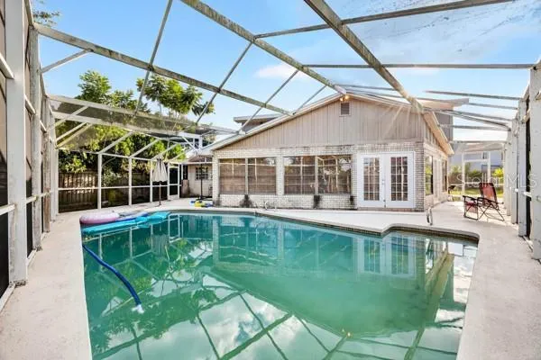 a view of a swimming pool with a patio
