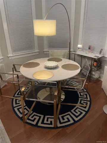 a table with chairs and a stove