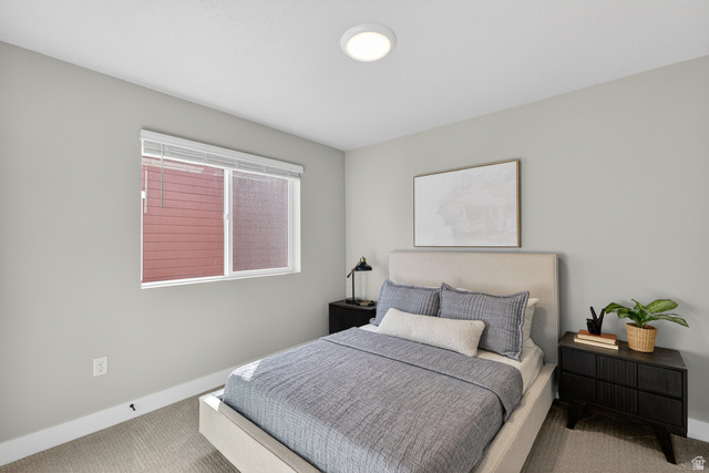 2841 West 2705 North, Unit 69 Ogden, UT 84404 - Photo 22 of 31 Neutral tone walls with carpeting and white baseboards provide a clean aesthetic