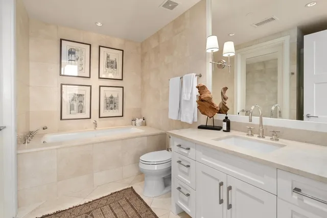 a en suite bathroom with a sink and a mirror