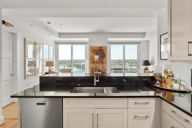 a kitchen with a stove oven and sink