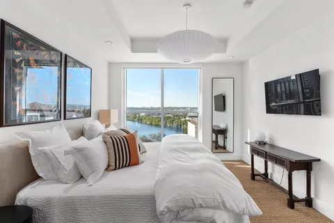 a bed room with a bed and a night stand