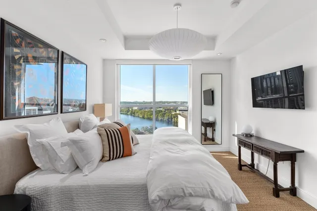 a bed room with a bed and a night stand