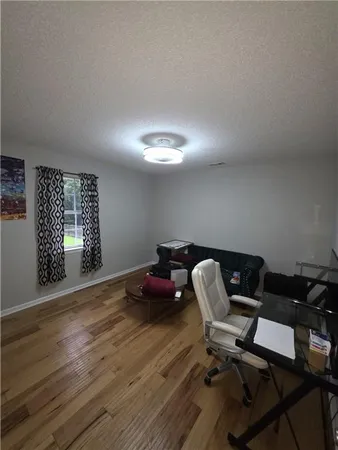 a workspace with furniture and window