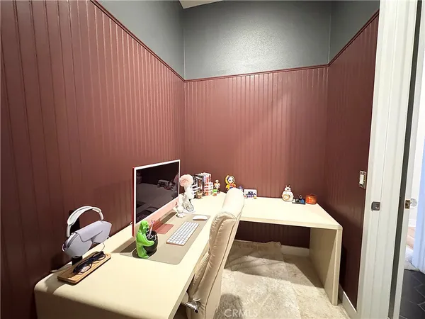a bedroom with a bed and a table
