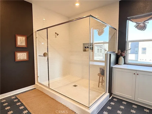 a bathroom with a shower and a sink
