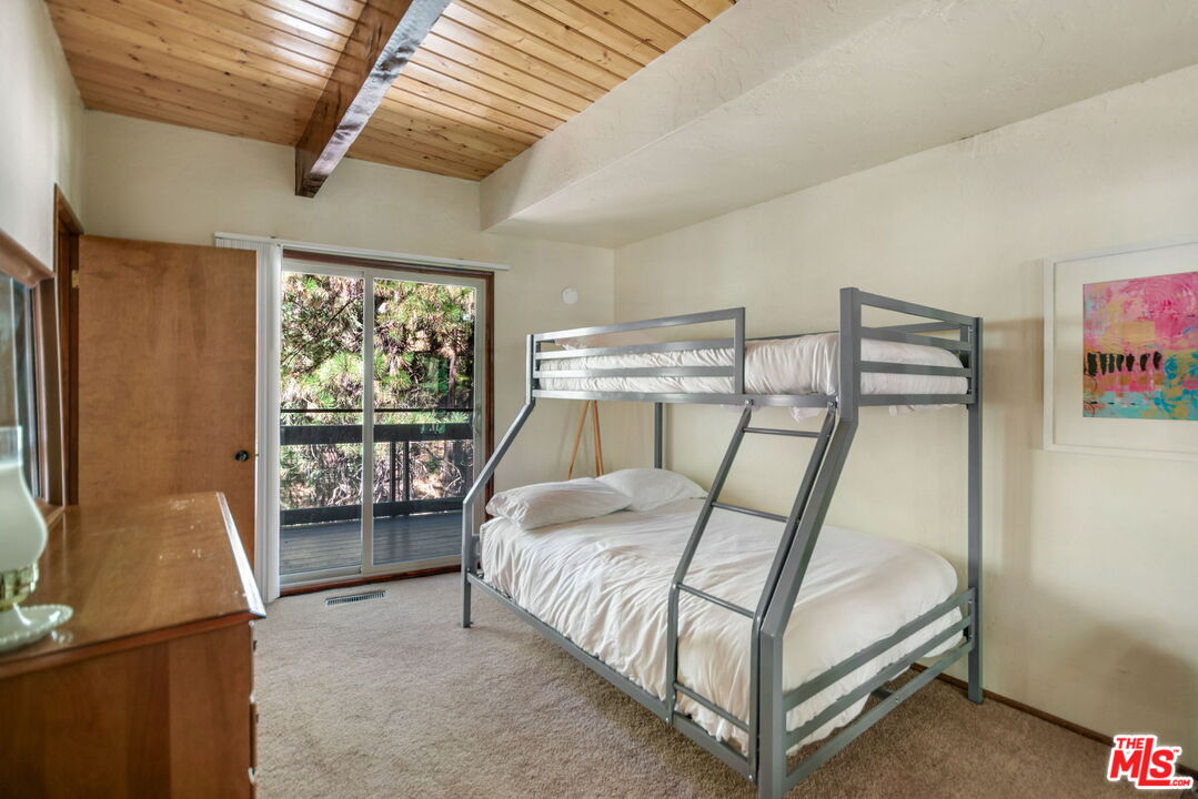 2378 Rim Of The World Drive Running Springs, CA 92382 - Photo 16 of 33 a bedroom with a bed and a window