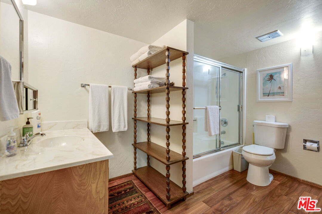 2378 Rim Of The World Drive Running Springs, CA 92382 - Photo 17 of 33 a bathroom with a sink toilet and shower