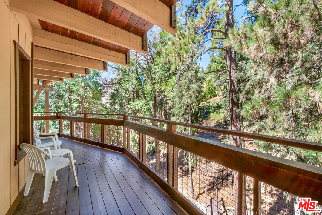 2378 Rim Of The World Drive Running Springs, CA 92382 - Photo 21 of 33 a view of a balcony with wooden floor and outdoor space
