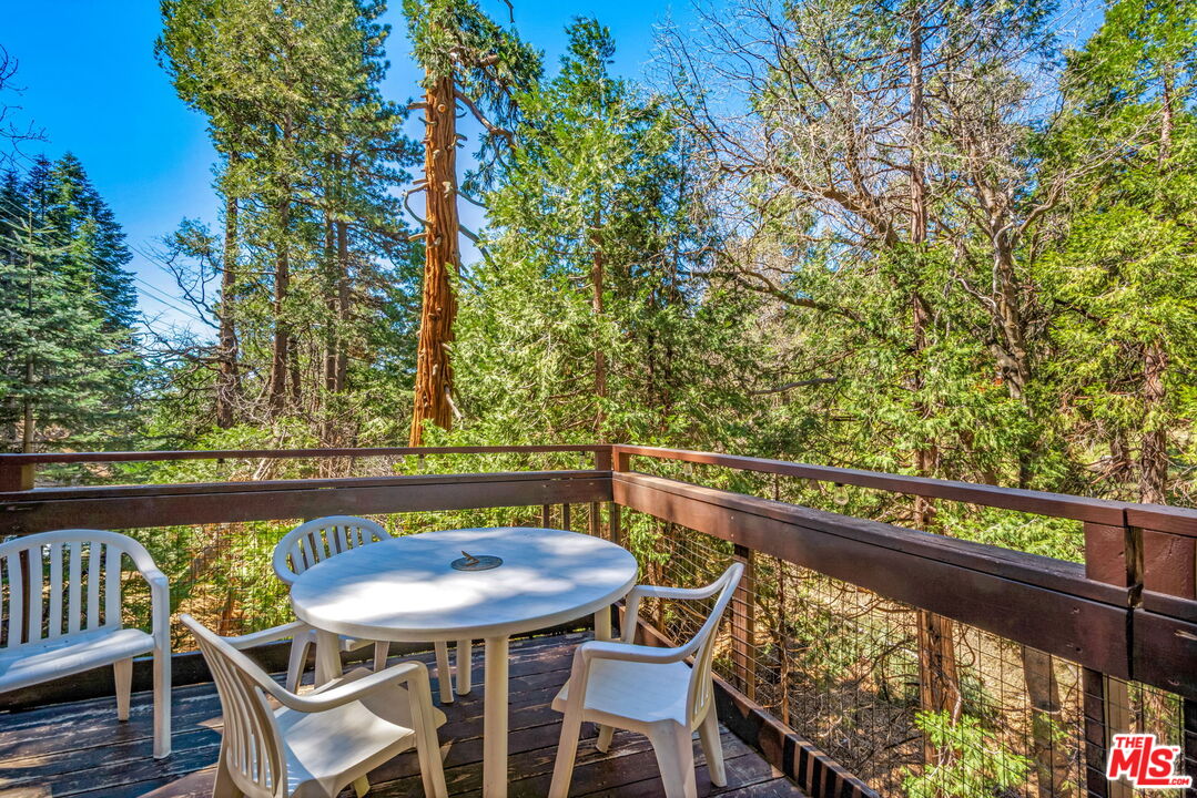2378 Rim Of The World Drive Running Springs, CA 92382 - Photo 29 of 33 a view of a chairs and table on the deck
