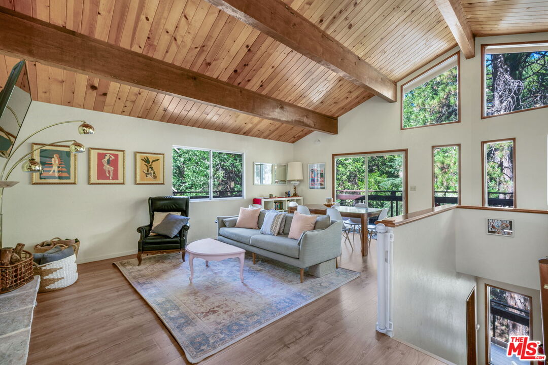 2378 Rim Of The World Drive Running Springs, CA 92382 - Photo 6 of 33 a living room with furniture and a large window