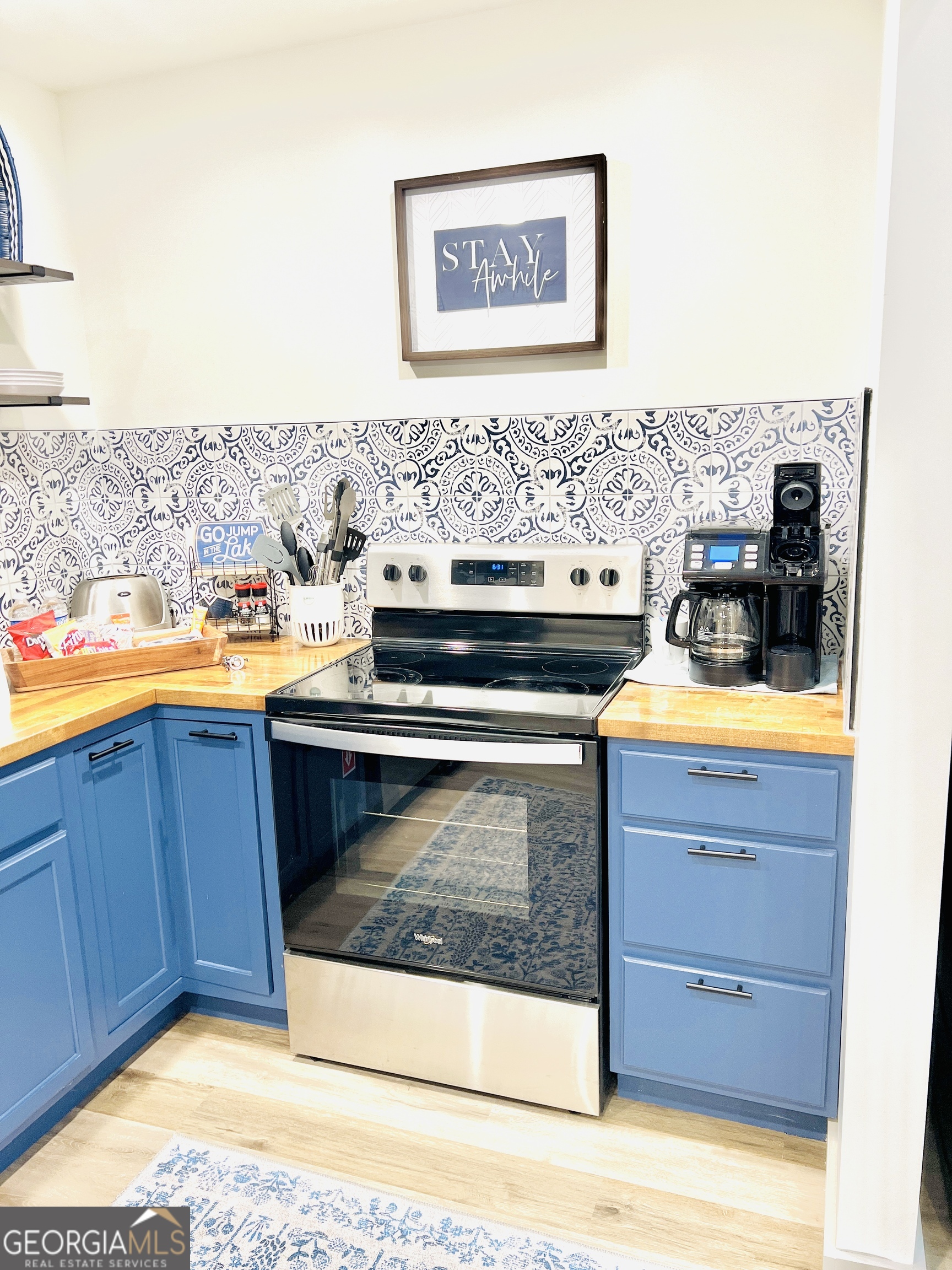 788 Lakeshore Road Martin, GA 30557 - Photo 13 of 29 a stove top oven sitting inside of a kitchen