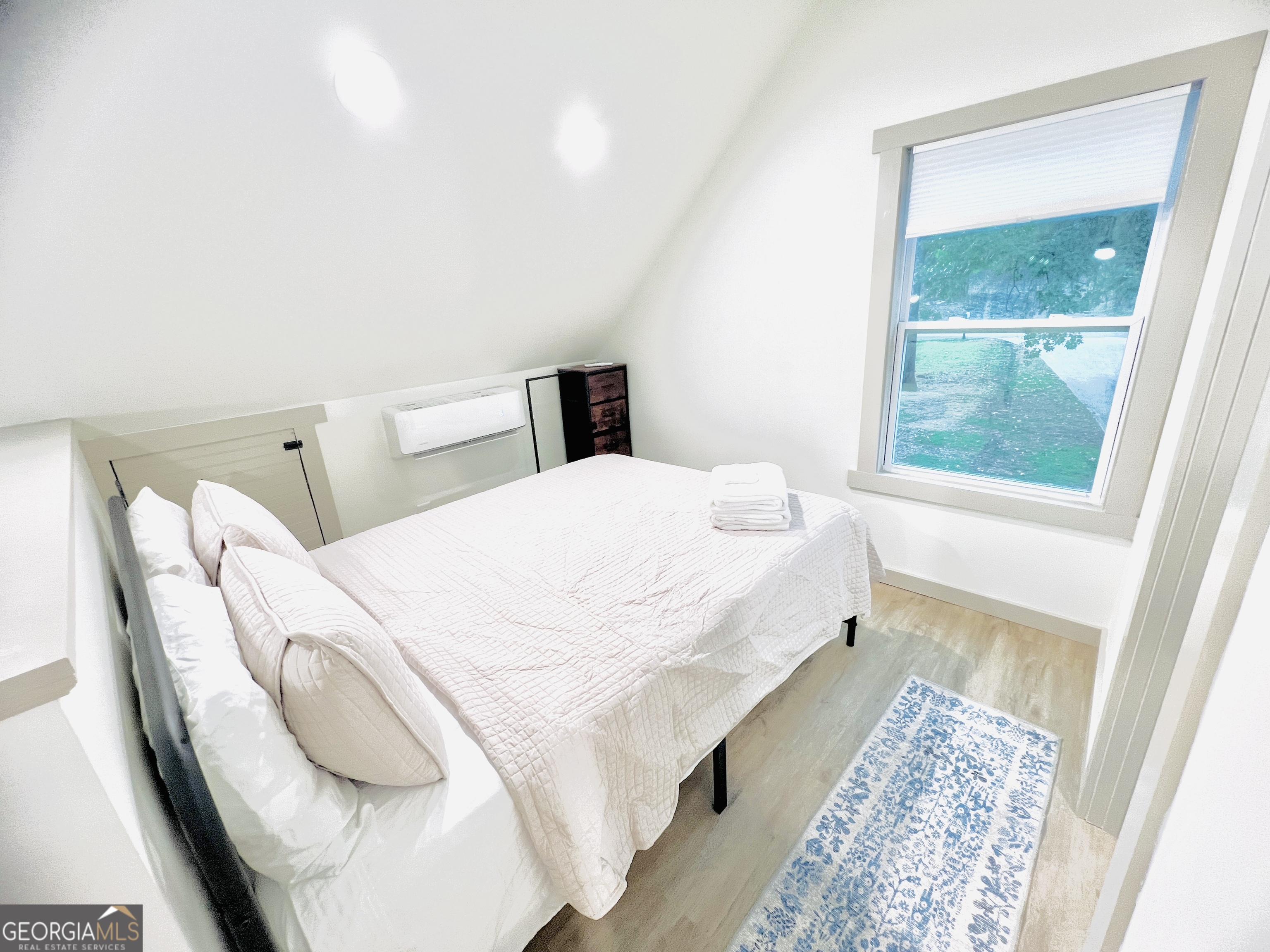 788 Lakeshore Road Martin, GA 30557 - Photo 19 of 29 a large white bed in a white room