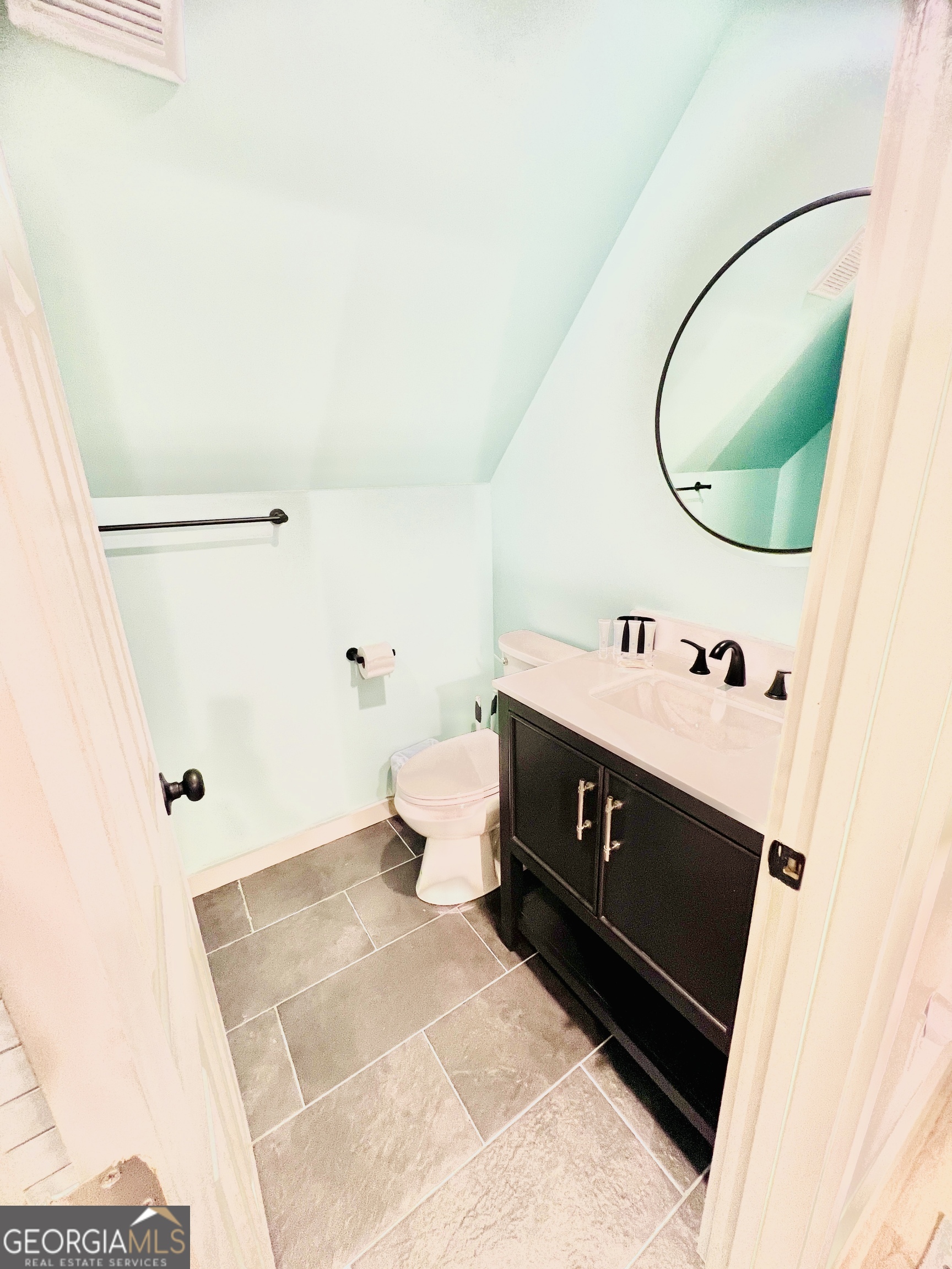 788 Lakeshore Road Martin, GA 30557 - Photo 21 of 29 a bathroom with a sink vanity mirror and toilet