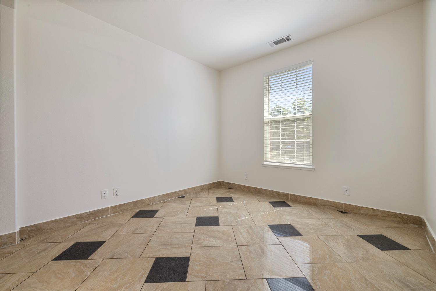 3105 Ripple Court Modesto, CA 95355 - Photo 8 of 46 an empty room with windows