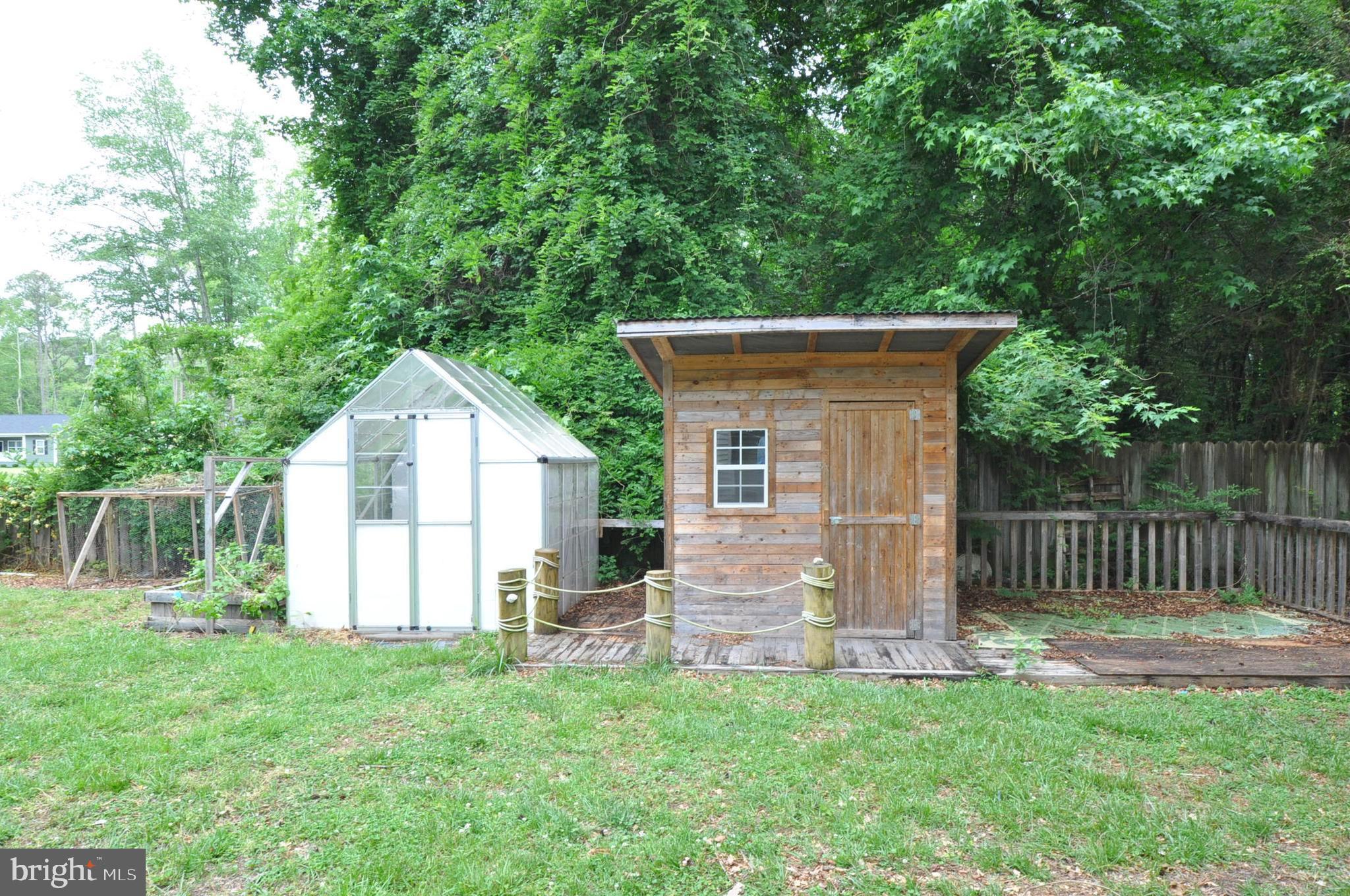 797 Forest Grove Road Colonial Beach, VA 22443 - Photo 29 of 40 Rear Yard with Shed and 2nd Green Greenhouse