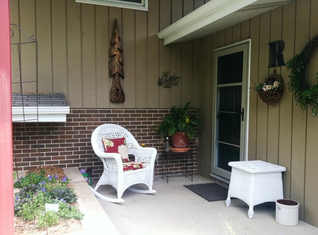 339 High Road Cary, IL 60013 - Photo 24 of 25 a bench sitting in front of a building