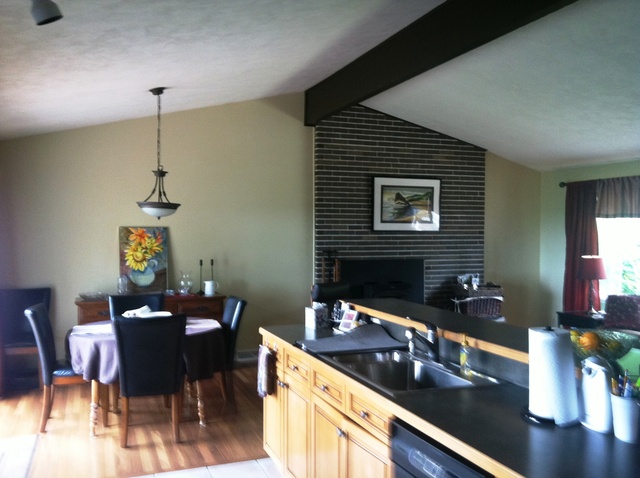 339 High Road Cary, IL 60013 - Photo 6 of 25 a kitchen with a sink cabinets and dining table