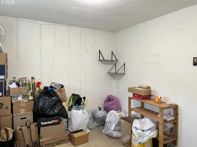 a bedroom with a bed and flat screen tv