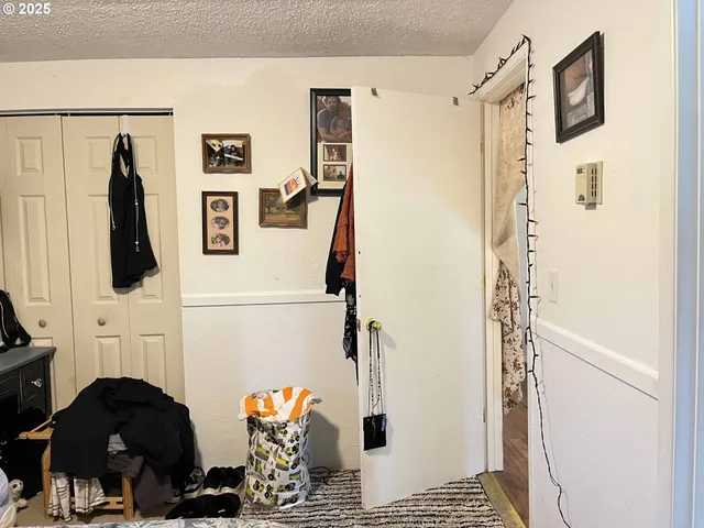 a bathroom with a toilet and a mirror