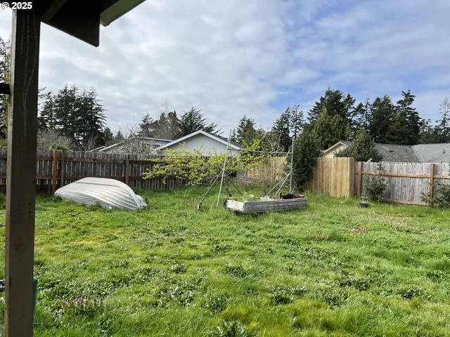 a view of a house with swimming pool and garden