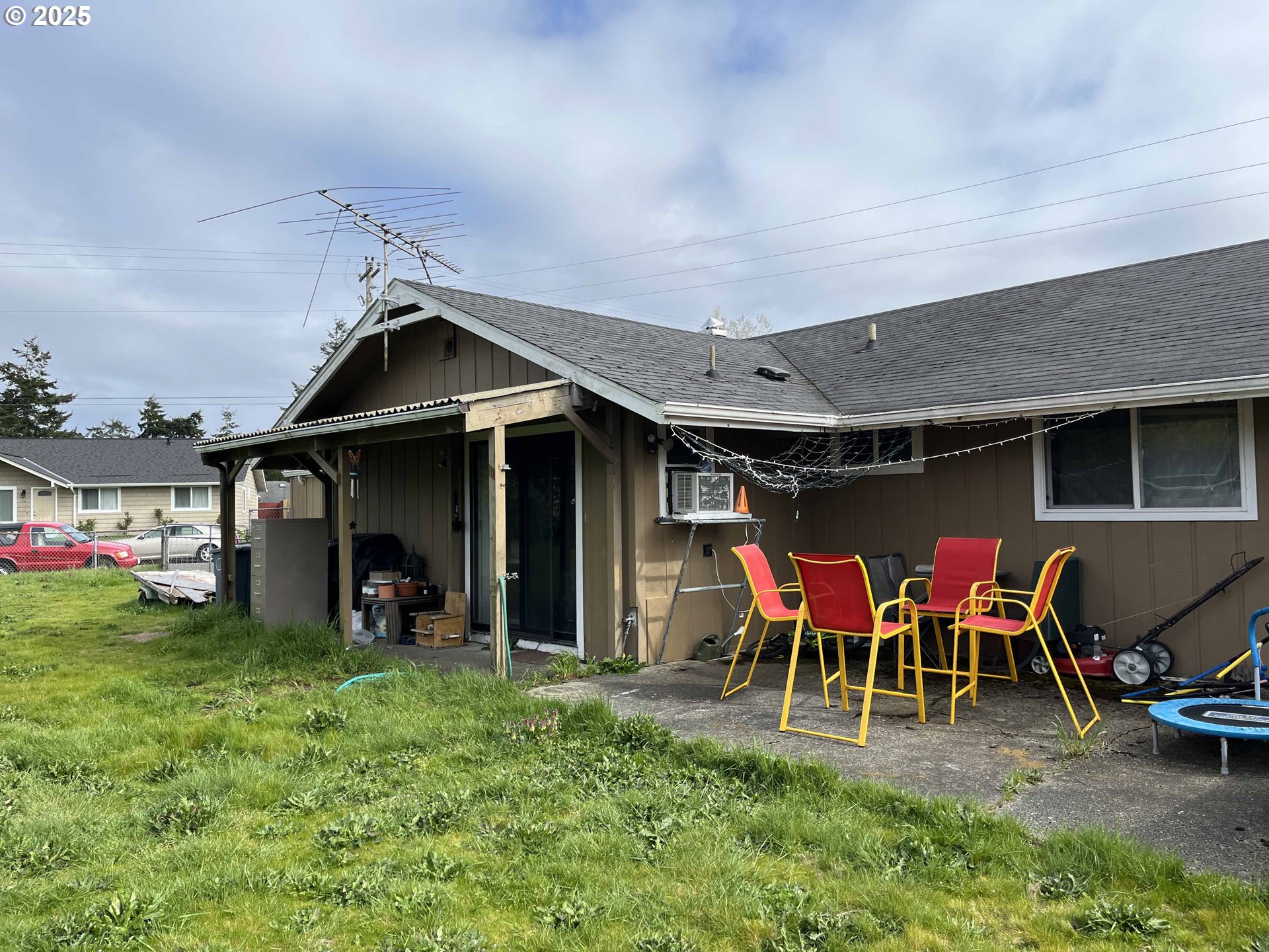 2385 19th Street Florence, OR 97439 - Photo 36 of 47 a view of a chairs and table in patio with a yard