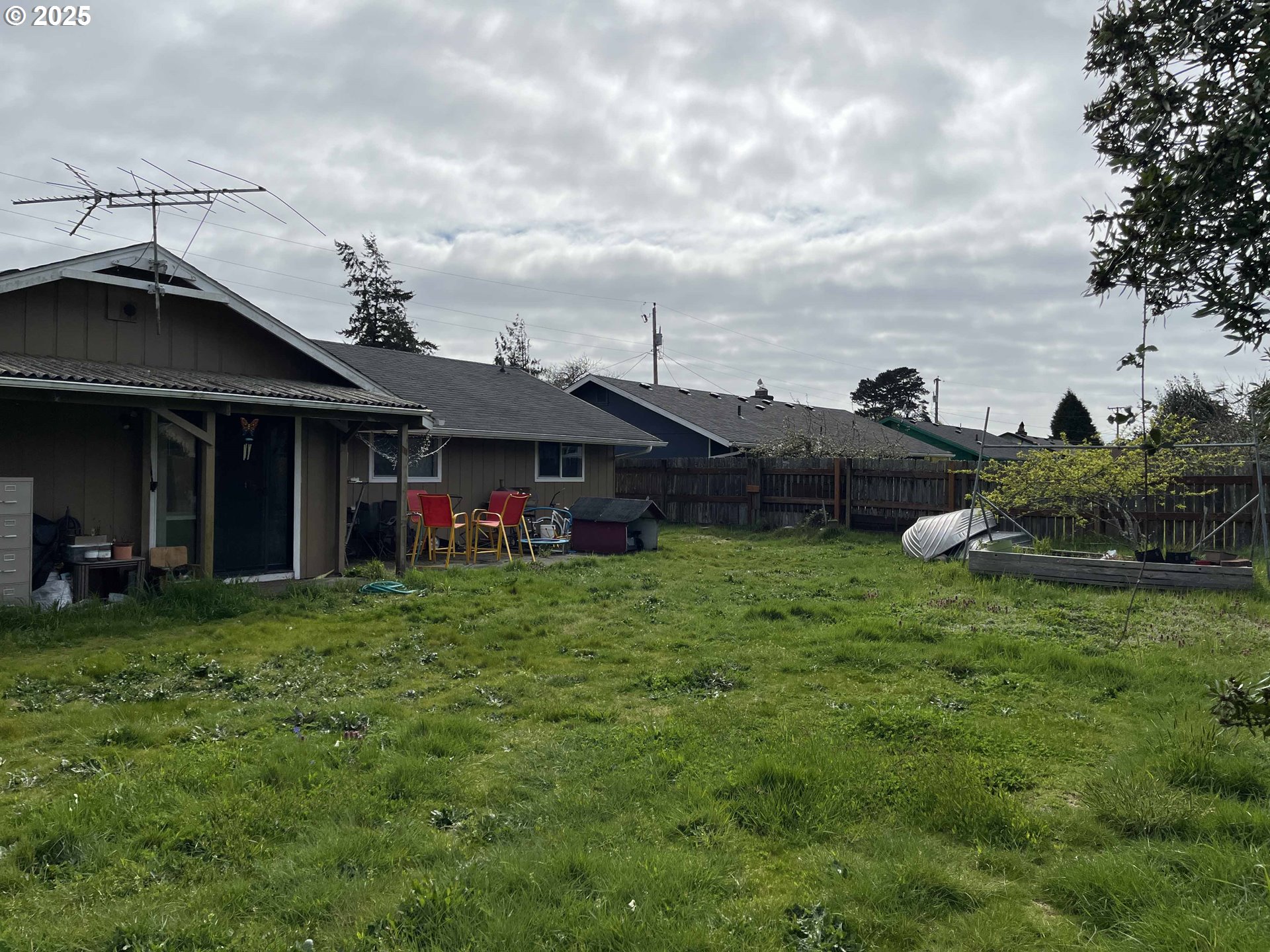 2385 19th Street Florence, OR 97439 - Photo 37 of 47 a view of a house with a backyard