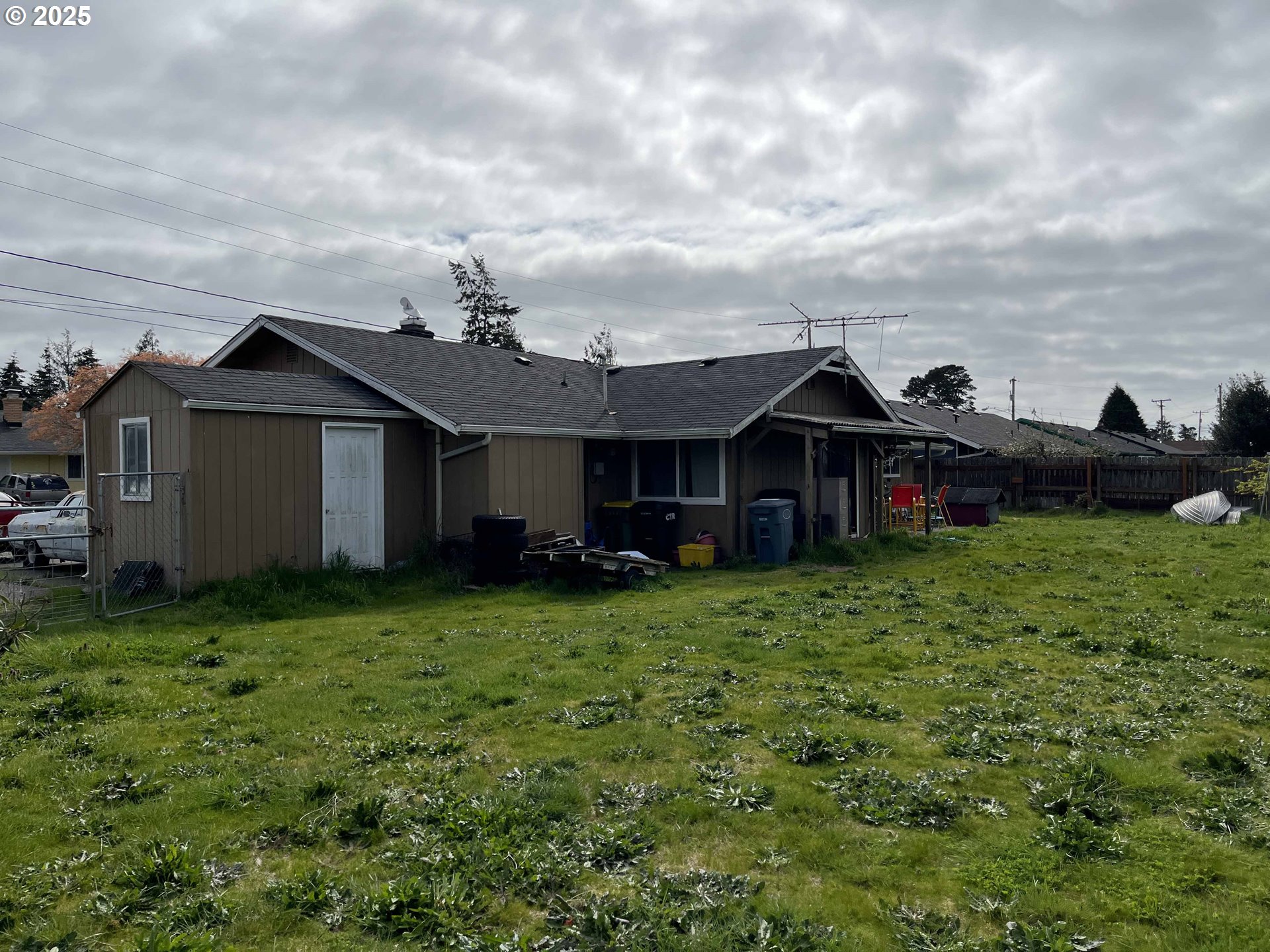 2385 19th Street Florence, OR 97439 - Photo 38 of 47 a front view of a house with garden