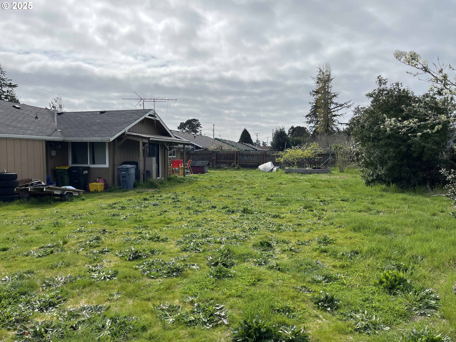 2385 19th Street Florence, OR 97439 - Photo 39 of 47 a view of a house with a yard and sitting area