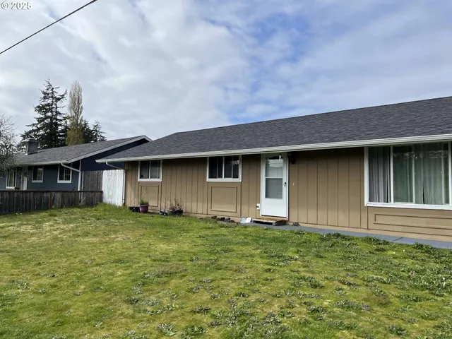 a brick house with a yard