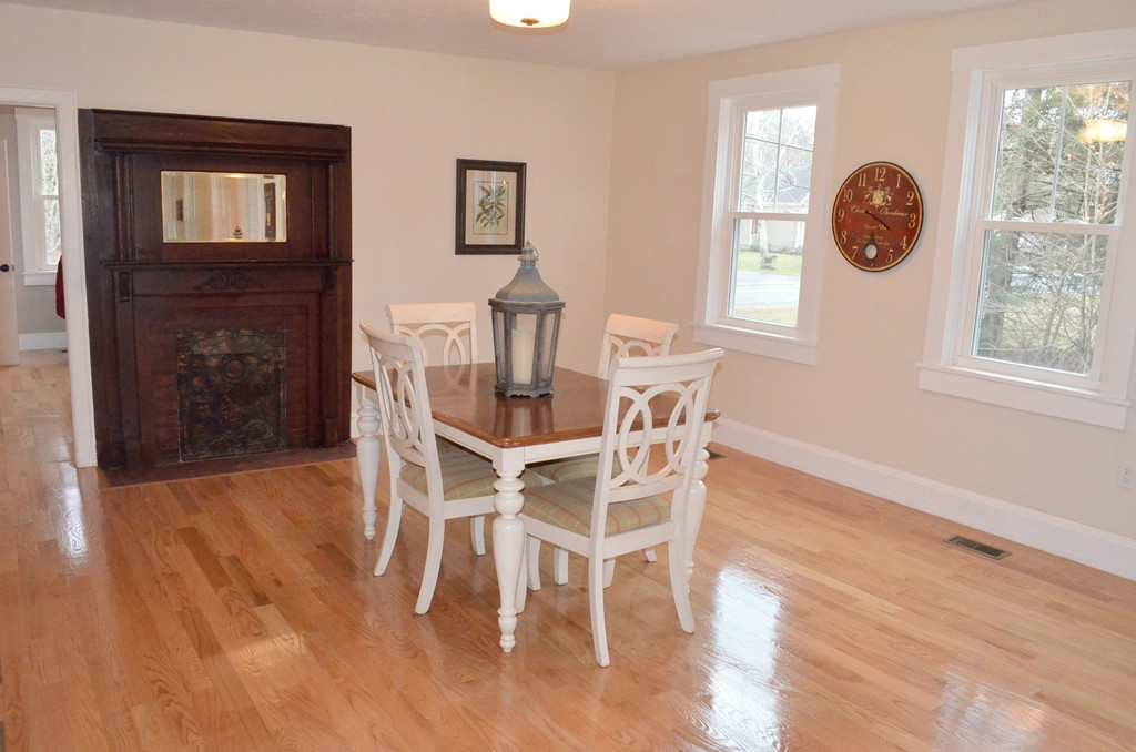 144 Pleasant Street Raynham, MA 02767 - Photo 16 of 29 a view of a dining room with furniture window and wooden floor