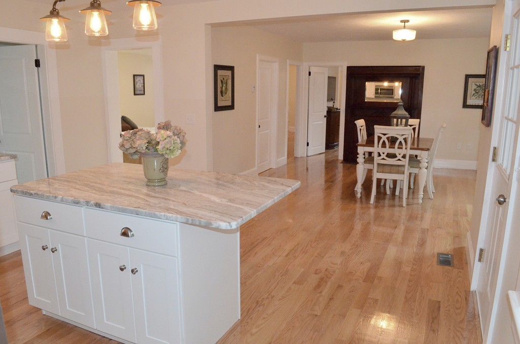 144 Pleasant Street Raynham, MA 02767 - Photo 17 of 29 a view of a dining room with furniture and wooden floor