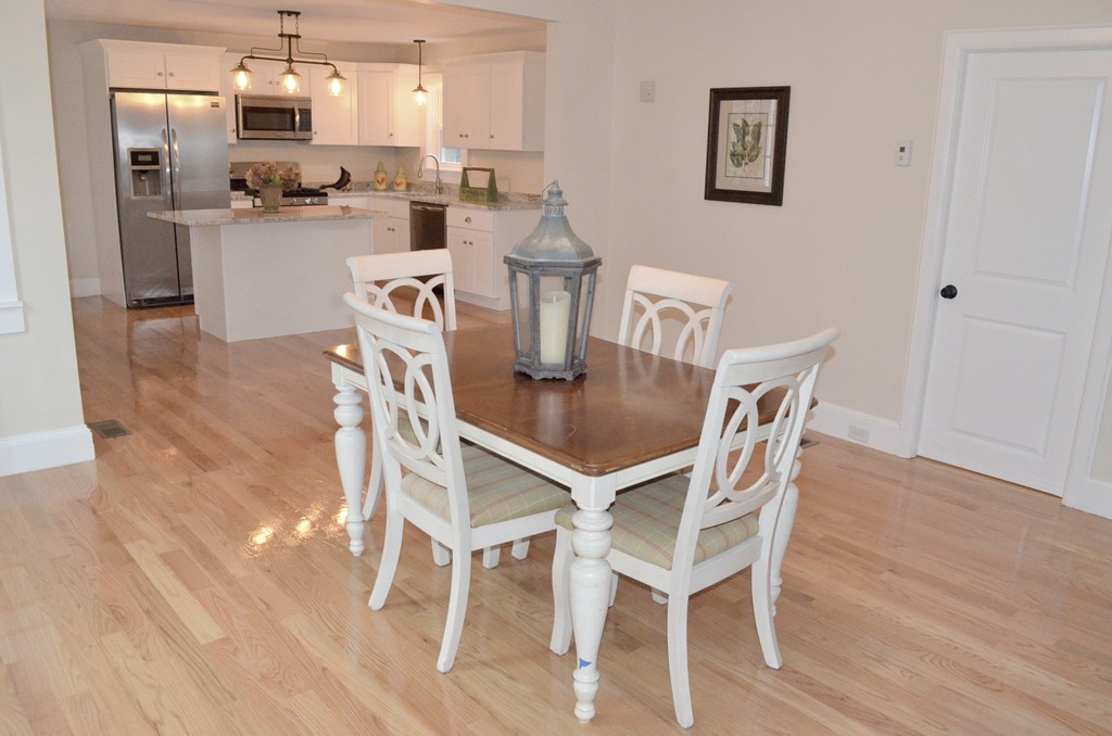 144 Pleasant Street Raynham, MA 02767 - Photo 19 of 29 a view of a dining room with furniture and wooden floor