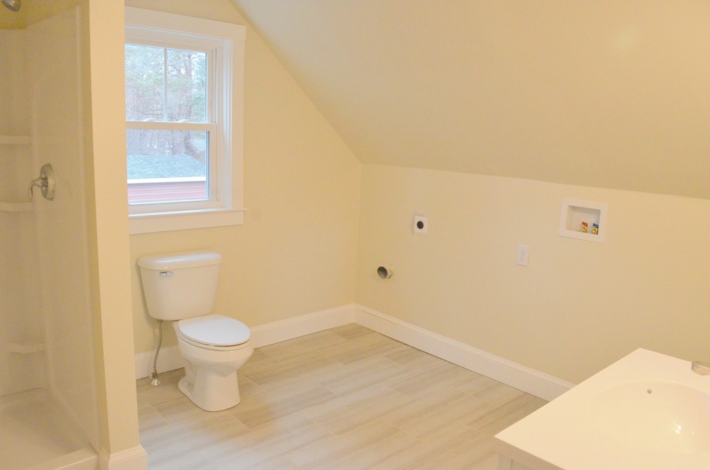 144 Pleasant Street Raynham, MA 02767 - Photo 24 of 29 a bathroom with a sink and a toilet