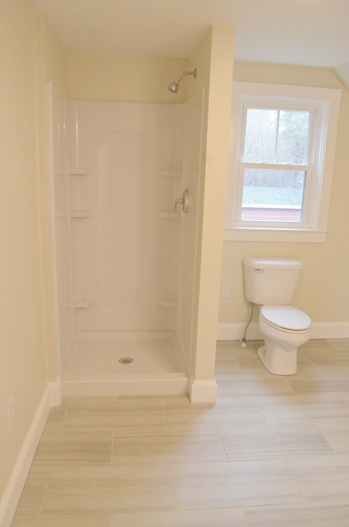 144 Pleasant Street Raynham, MA 02767 - Photo 25 of 29 a bathroom with a toilet and a shower