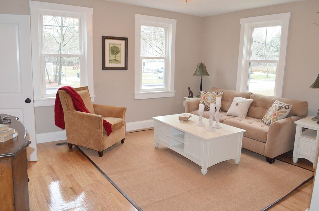 144 Pleasant Street Raynham, MA 02767 - Photo 6 of 29 a living room with furniture and a window