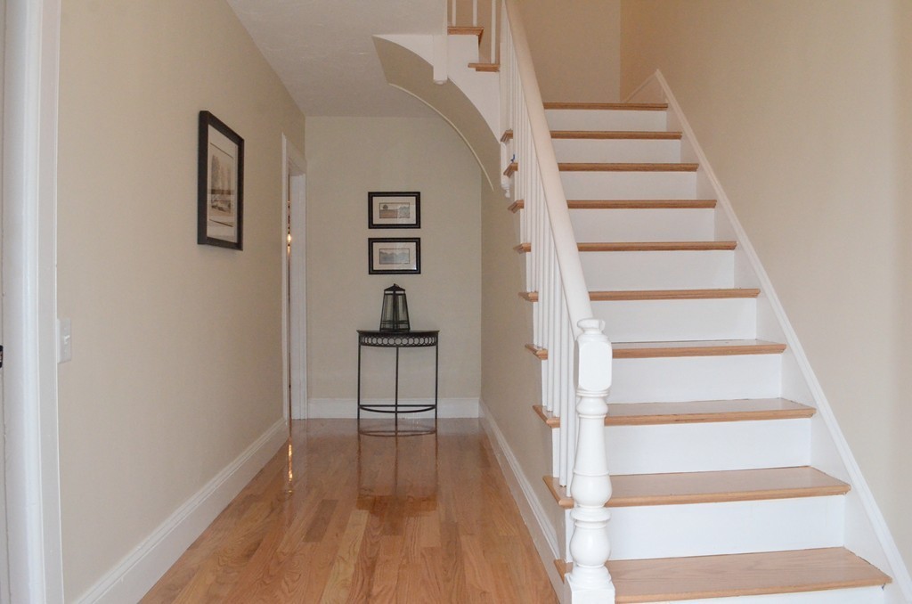 144 Pleasant Street Raynham, MA 02767 - Photo 9 of 29 a view of entryway and hall with wooden floor