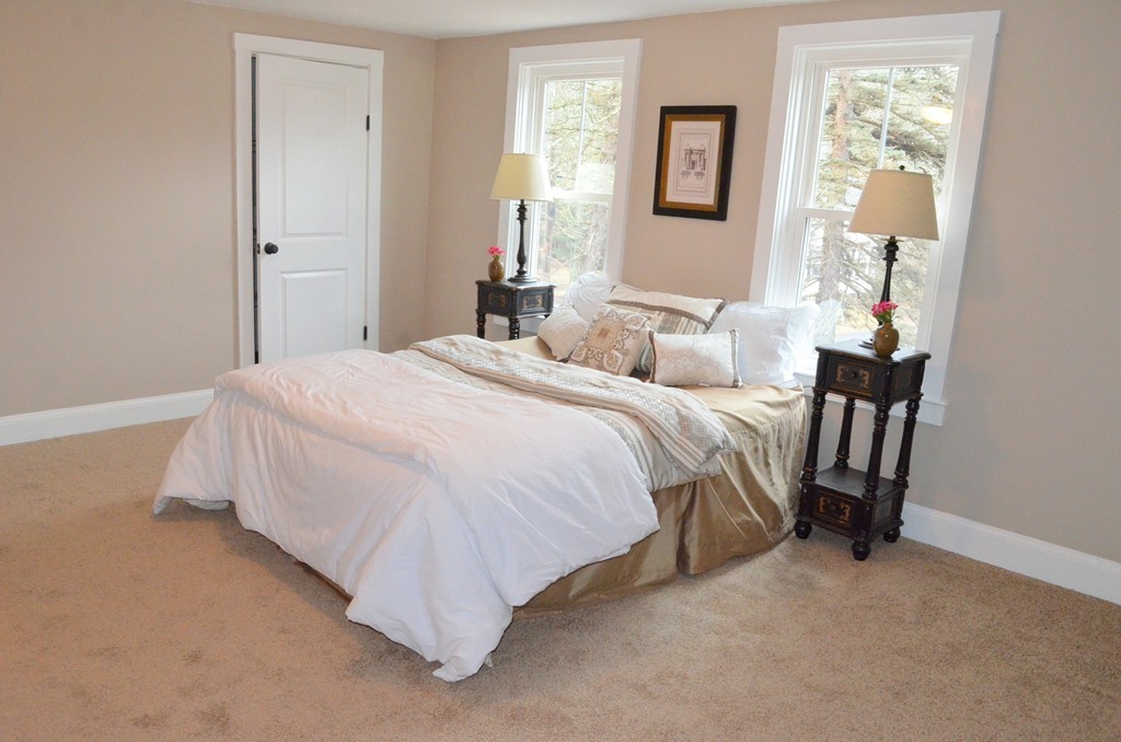 144 Pleasant Street Raynham, MA 02767 - Photo 10 of 29 a bedroom with a bed and a window