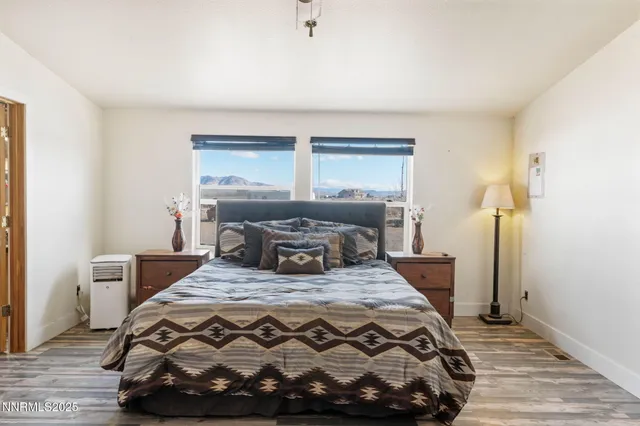 a bathroom with a tub sink vanity granite and shower