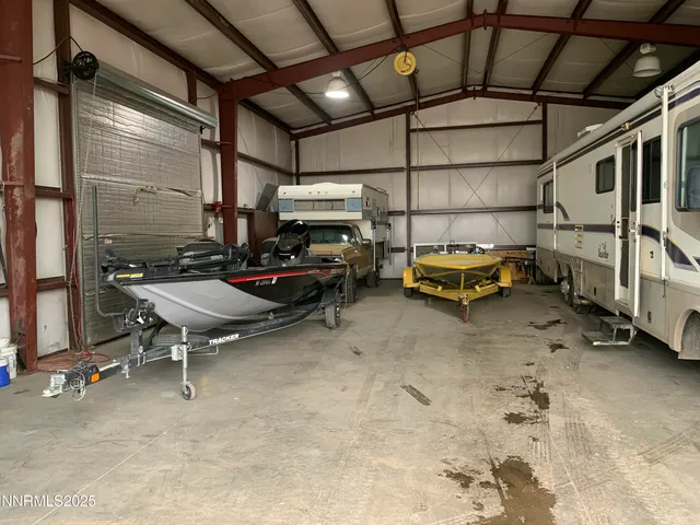 a kitchen with stainless steel appliances granite countertop a stove and a wooden floors