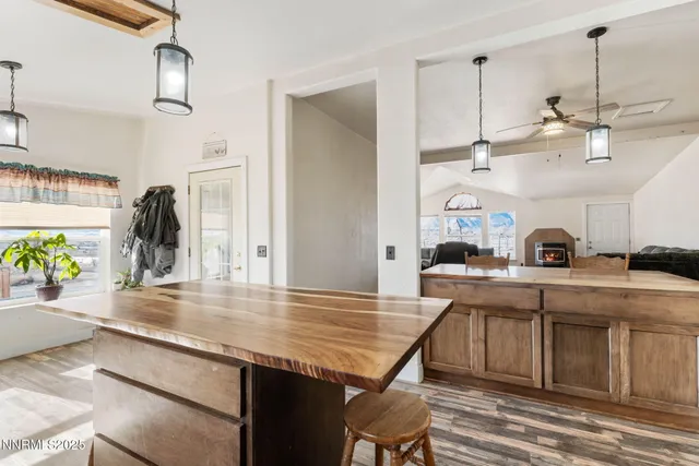 a living room with furniture a chandelier a rug and a chandelier