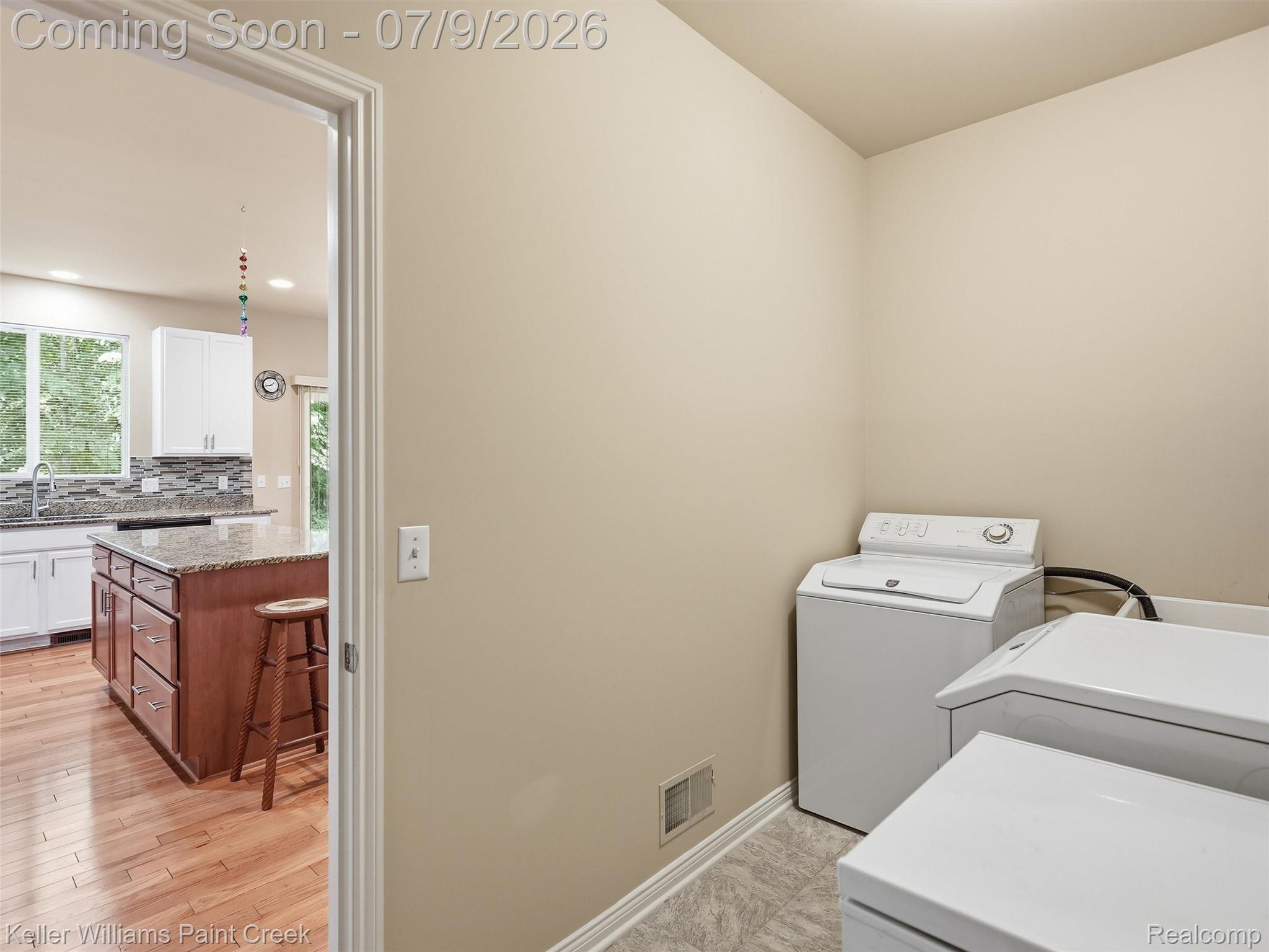846 Monterey Ln. Rochester, MI 48307 - Photo 19 of 52 Dedicated laundry space featuring neutral-toned walls and tile flooring